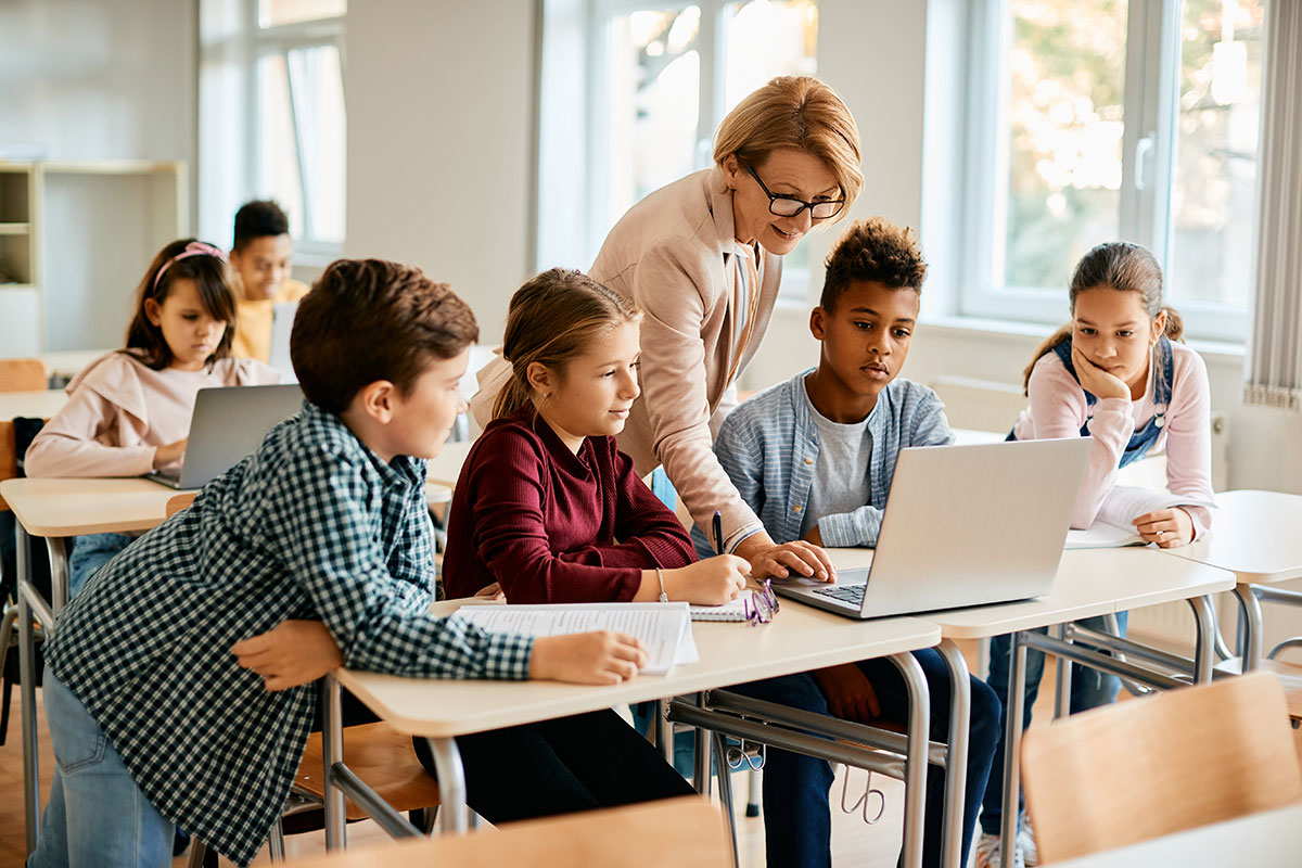 group of students using laptop