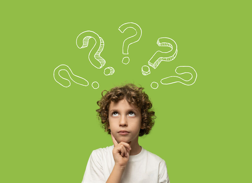 child thinking with question marks floating around his head
