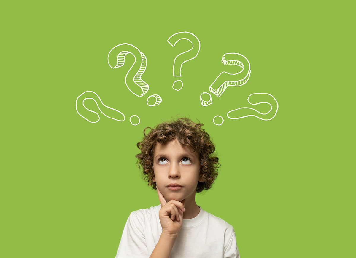 child thinking with question marks floating around his head
